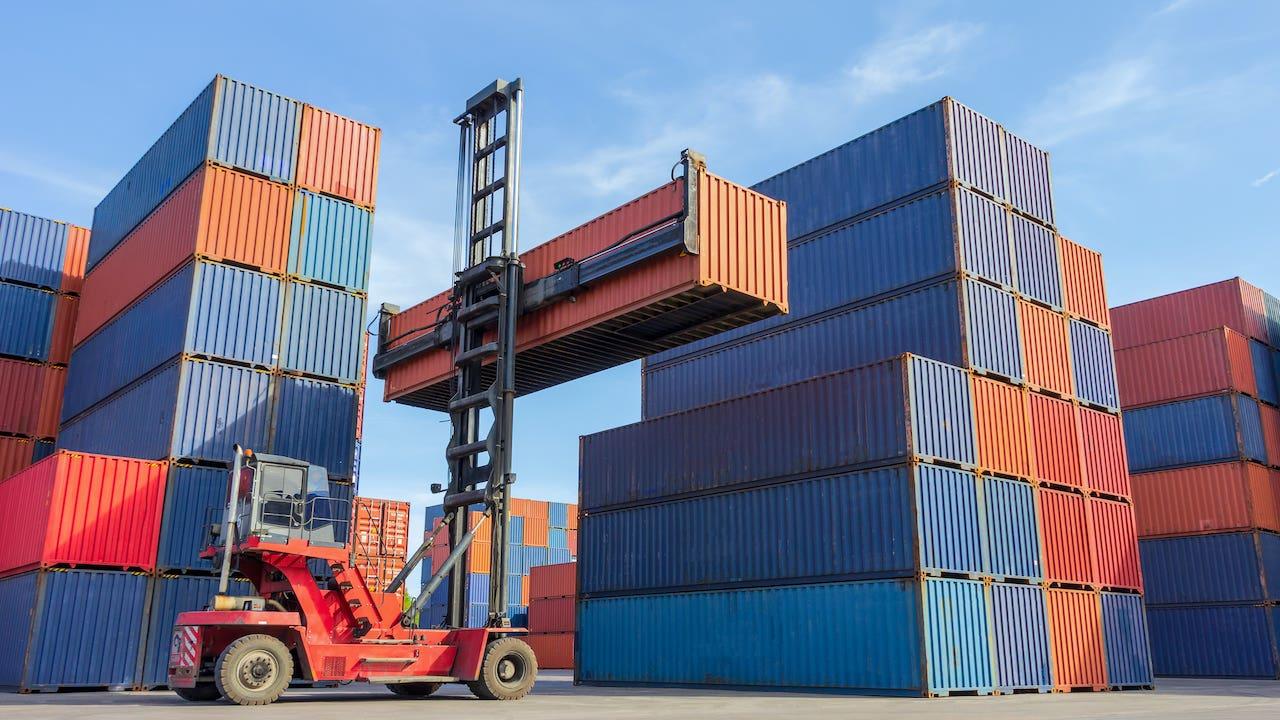 A collection of modified shipping containers, including an office, a cafe, and a workshop.