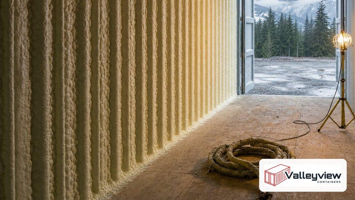 Daylight falling on the marine plywood floor inside an open shipping container in a British Columbia yard